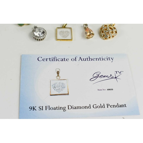 238 - A group of jewellery comprising a Swarovski heart pendant, a 9ct gold floating diamond pendant, 1.5g... 