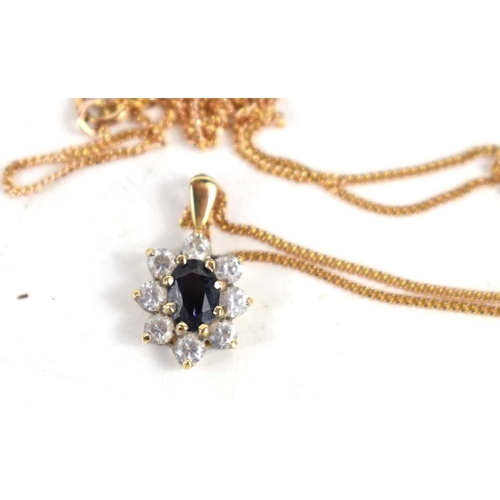 244 - A 9ct gold pendant and chain, 3.5g,together with a pair of earrings set with sapphire and diamonds.