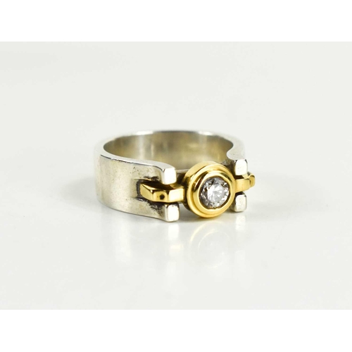 26 - An 18ct bi-coloured gold and diamond ring by Christopher Anderson, the brilliant cut diamond approxi... 