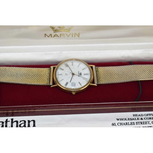 268 - A 9ct gold cased Marvin gentleman's wristwatch, stainless steel strap, with original insurance valua... 