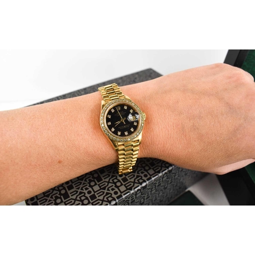 281 - A lady's Rolex Cellini 18ct gold Oyster Perpetual Datejust wristwatch, the signed black dial with di... 