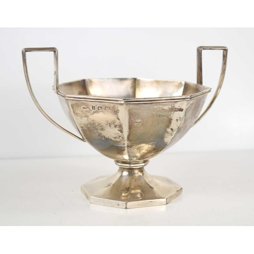 298 - A silver twin handled pedestal bowl of octagonal form, hallmarked for Birmingham, 13cm high, 9.4toz