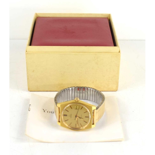 308 - A gold coloured Omega Geneve manual date adjust, with original box, paperwork when purchased in 1973... 