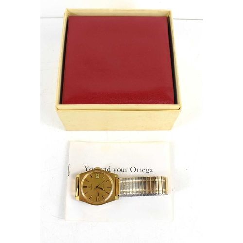 308 - A gold coloured Omega Geneve manual date adjust, with original box, paperwork when purchased in 1973... 