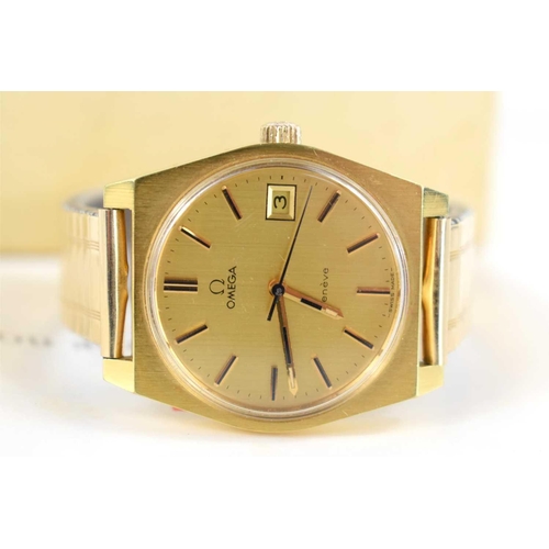 308 - A gold coloured Omega Geneve manual date adjust, with original box, paperwork when purchased in 1973... 