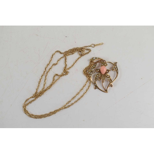 31 - A 9ct gold Edwardian pendant of heart shaped form with lily to the centre, set with angel coral and ... 