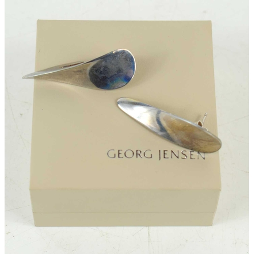 32 - A pair of Georg Jensen silver ear cuff earrings, of twisted teardrop design, each 4cm long.