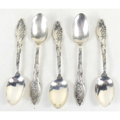 346 - A set of five silver teaspoons, the handles decorated with floral sprays, 3.3toz.