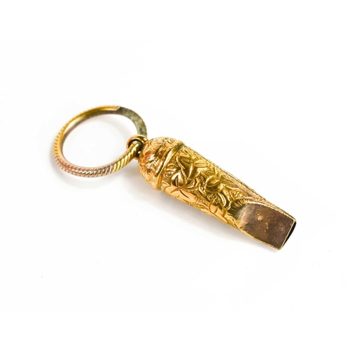 35 - A small gold whistle, unmarked but testing as at least 9ct gold, engraved with chased decoration, on... 