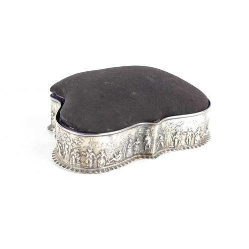 404 - A silver serpentine shaped jewellery sewing box, with pin cushion cover, the box with a village scen... 