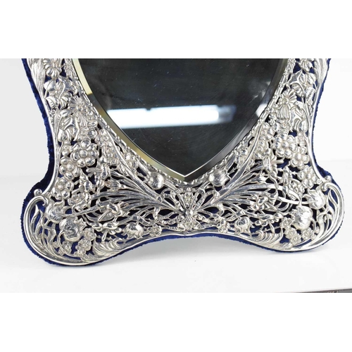 410 - A fine Victorian heart shaped dressing table mirror with a bevelled shaped glass, decorated with int... 