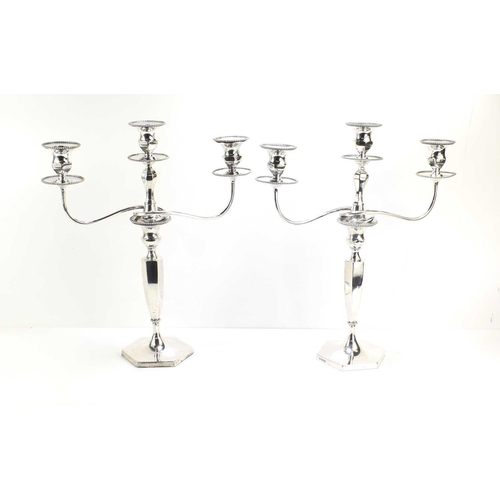 417 - A pair of Edwardian silver candlesticks with a silver plated candelabra top section with three branc... 
