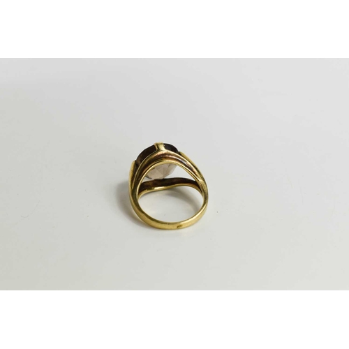 57 - A 9ct gold and smokey quartz dress ring, the circular facet cut quartz in a modern style setting, si... 