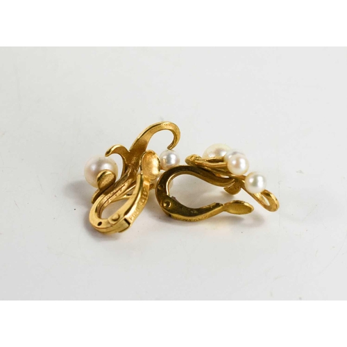 58 - A pair of 9ct gold and pearl earrings, of foliate form, engraved with decoration, 4.46g.
