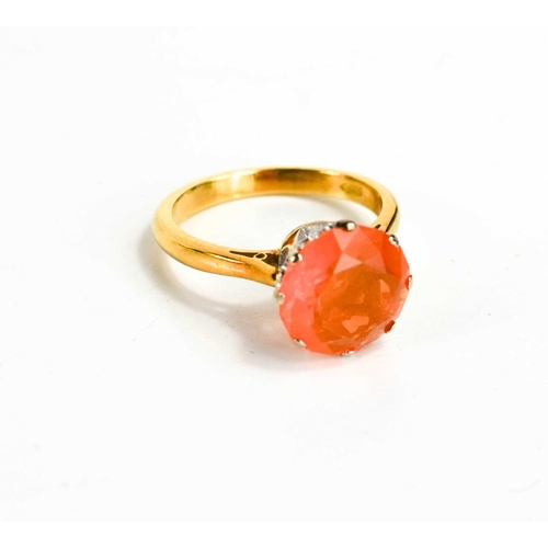 61 - An 18ct gold and fire opal solitaire ring, the stone of approximately 10.45mm diameter, size M, 4.7g... 