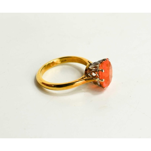 61 - An 18ct gold and fire opal solitaire ring, the stone of approximately 10.45mm diameter, size M, 4.7g... 