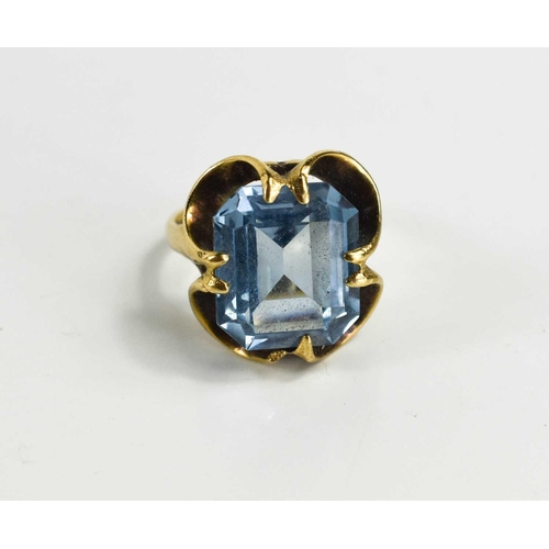 62 - A 9ct gold and emerald cut blue stone dress ring, size O, 5.7g.