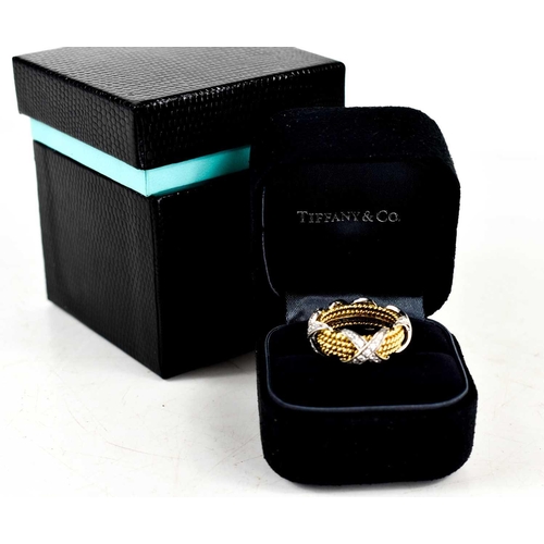 65 - A Tiffany & Co by Schlumberger Studios 18ct gold and diamond ring, composed of four yellow gold rope... 