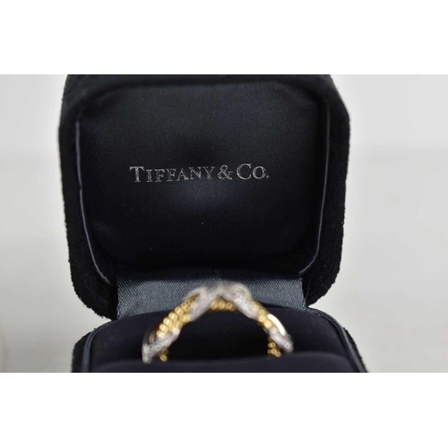 65 - A Tiffany & Co by Schlumberger Studios 18ct gold and diamond ring, composed of four yellow gold rope... 