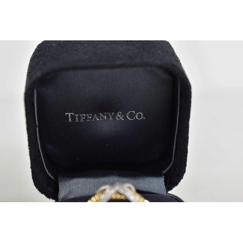 65 - A Tiffany & Co by Schlumberger Studios 18ct gold and diamond ring, composed of four yellow gold rope... 