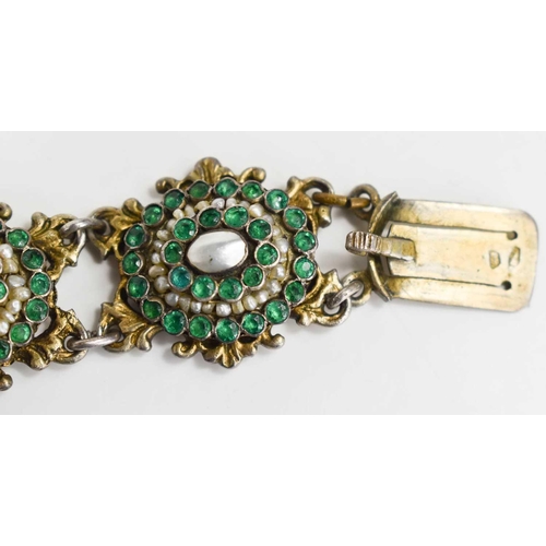 77 - A Georgian 19th century white metal, green paste and pearl set bracelet, with eight links bearing re... 