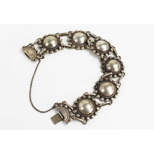 78 - A sterling silver bracelet, likely Norway / Sweden origin, composed of six circular links and a slid... 