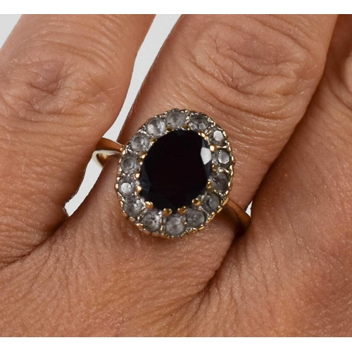 79 - A 9ct gold, garnet and cubic zirconia dress ring, size P, 4.1g.
