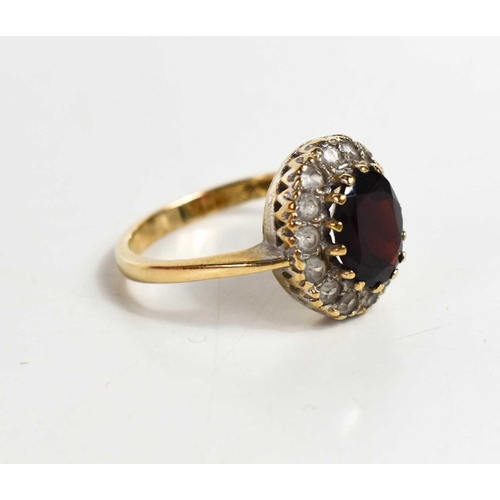 79 - A 9ct gold, garnet and cubic zirconia dress ring, size P, 4.1g.