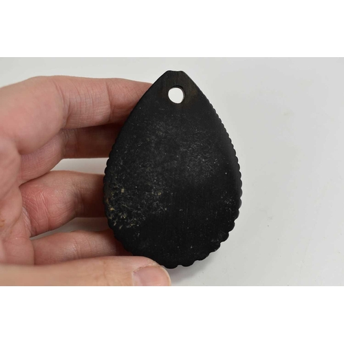 85 - A Victorian ebony mourning pendant, of teardrop form, carved with a female bust, 6.5 by 4.5cm.