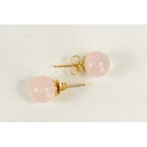 86 - An almost pair of rose quartz and gold earrings, one with 9ct gold posts, the other with 14ct gold p... 