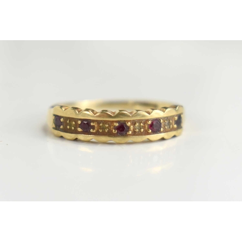 87 - A 9ct gold ruby and diamond nine stone ring, size L, 1.5g.