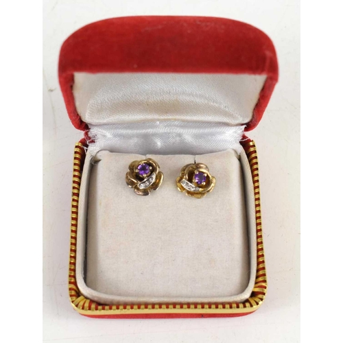 91 - A pair of amethyst and gold coloured earrings, the backs marked 825s, with case. 