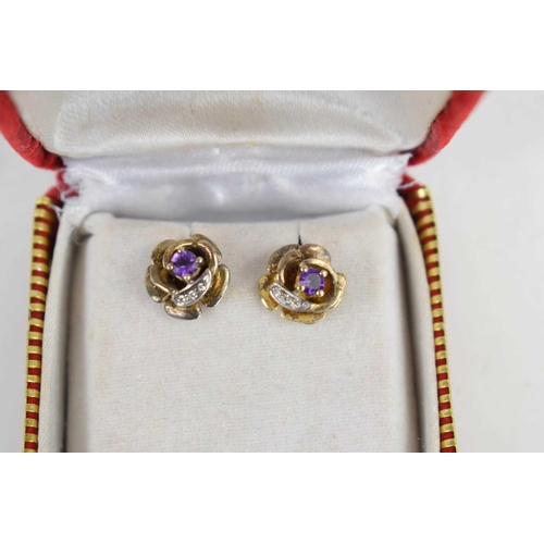 91 - A pair of amethyst and gold coloured earrings, the backs marked 825s, with case. 