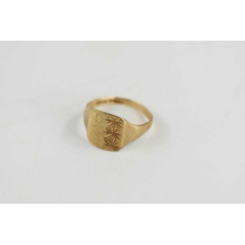 92 - A 9ct gold signet ring, engraved with the initials BCG beside starbursts, size R, 2.1g.