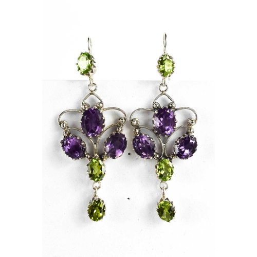 95 - A pair of silver, amethyst and peridot set earrings, of floral form, 6½cm long.