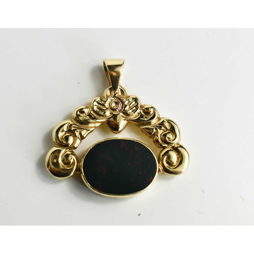 98 - A 9ct gold swivel fob, the floral and foliate frame set with an oval bloodstone, 38.2 by 38mm, 17.68... 