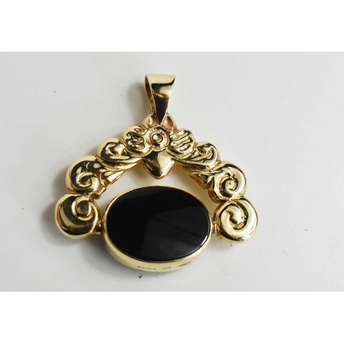98 - A 9ct gold swivel fob, the floral and foliate frame set with an oval bloodstone, 38.2 by 38mm, 17.68... 