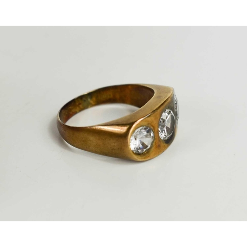 99 - A 9ct gold three stone ring, set with white paste, size U, 9.83g.