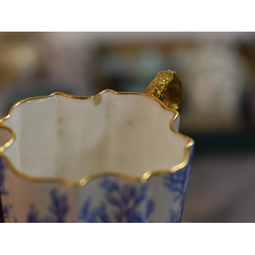 287 - A 19th century Coalport part coffee set, decorated with blue coral and gilded handles and rims.