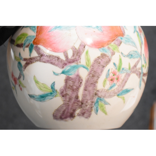 306 - A 19th century Chinese bottle form vase, depicting peaches and bats, 34cm high.