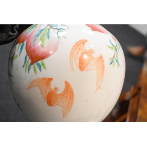 306 - A 19th century Chinese bottle form vase, depicting peaches and bats, 34cm high.