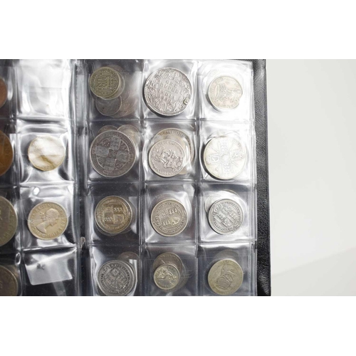 100 - An album of mostly British silver coins to include Queen Victoria shillings, Florins and others.