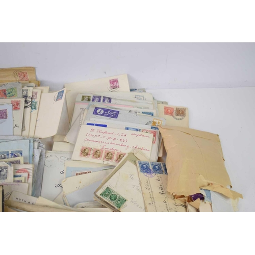 150 - A large collection of stamped envelopes, Victorian and later, together with a small quantity of loos... 