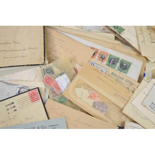 150 - A large collection of stamped envelopes, Victorian and later, together with a small quantity of loos... 