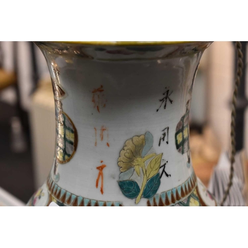 319 - A pair of 19th century Chinese vases, converted to lamps, the enamel decoration depicting flowers, C... 