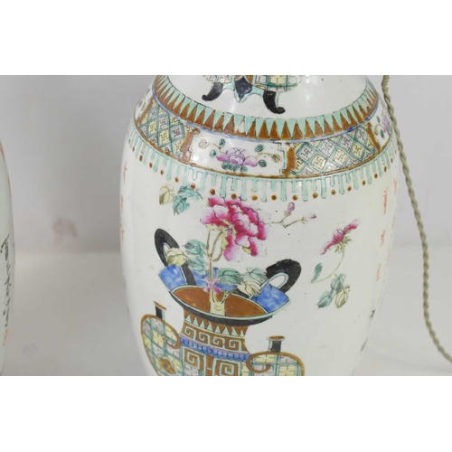 319 - A pair of 19th century Chinese vases, converted to lamps, the enamel decoration depicting flowers, C... 