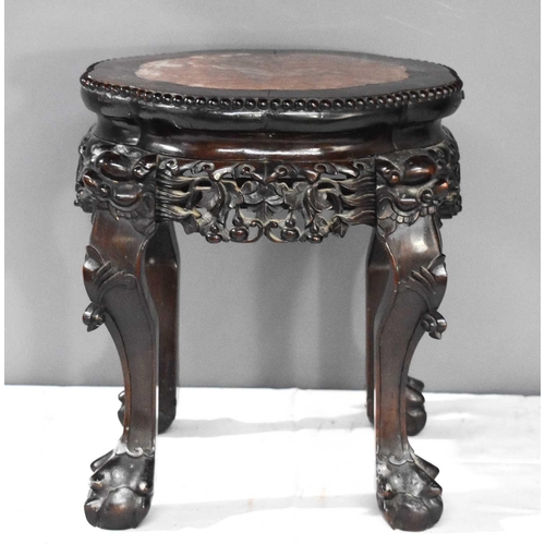 325 - A 19th century Chinese hardwood jardiniere stand, with a multifoil marble inset top, beaded edge, an... 