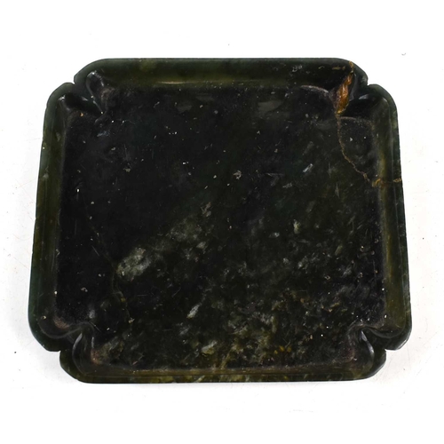 333 - An antique Chinese spinach jade dish, with recessed corners, 12.5cm by 11.5cm.