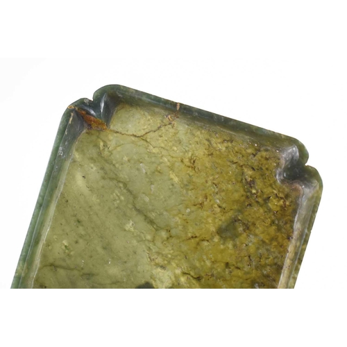 333 - An antique Chinese spinach jade dish, with recessed corners, 12.5cm by 11.5cm.