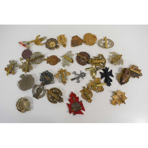 36 - A group of cap badges for British regiments including a The Royal Australian Engineers, Royal Armour... 